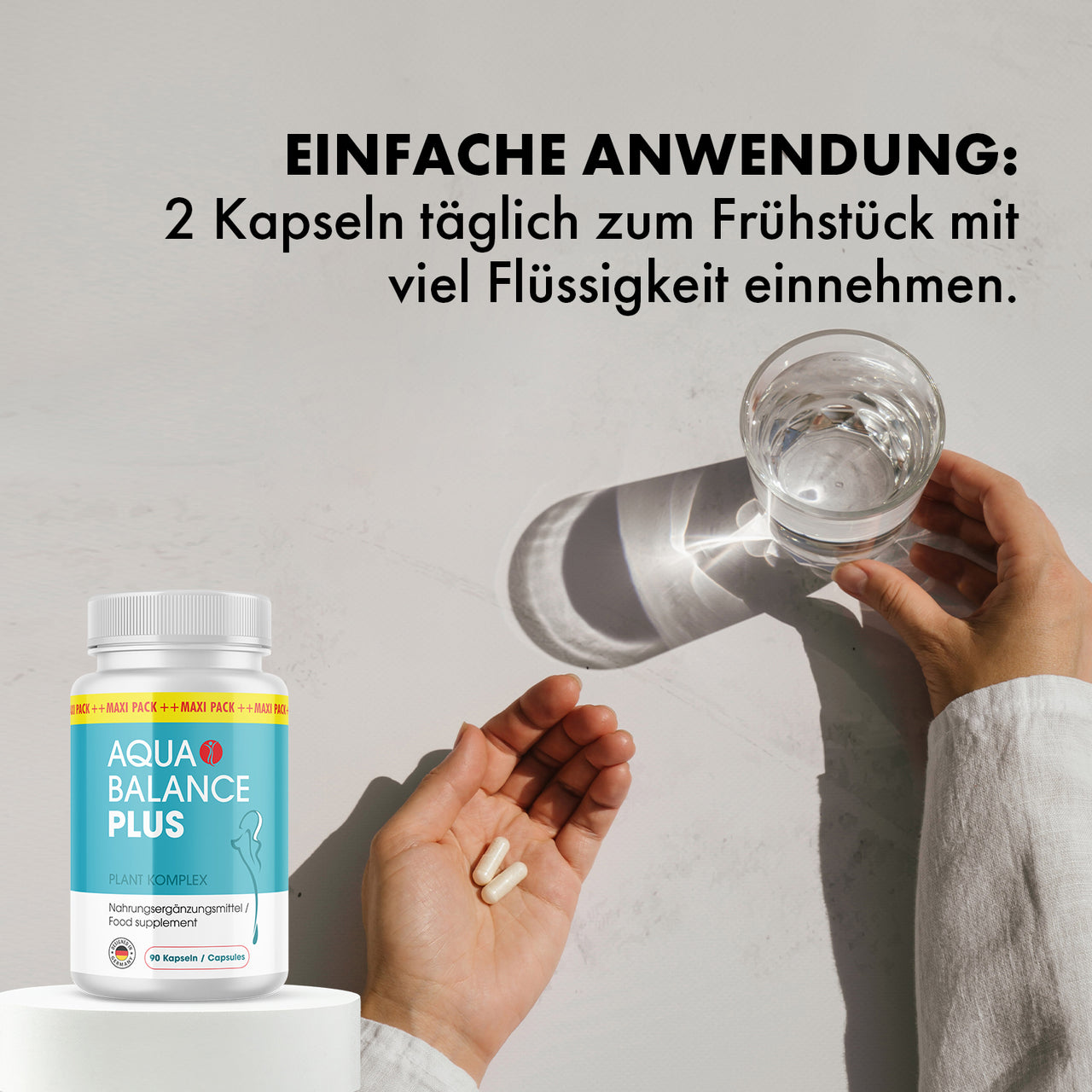 Text Einfache Anwendung 2 Kapseln täglich zum Frühstück mit viel Flüssigkeit einnehmen, Dose Aqua Balance Plus
