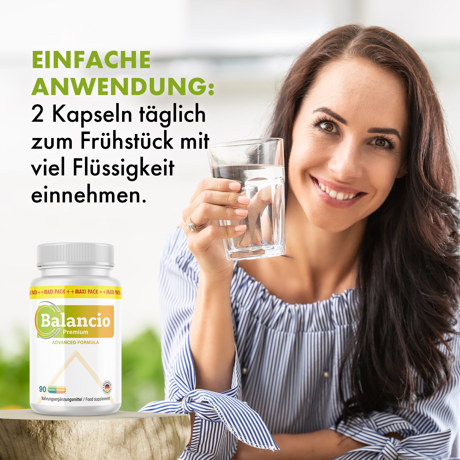 Frau hält Glas Wasser neben Balancio Premium Dose mit Anwendungshinweis 2 Kapseln täglich