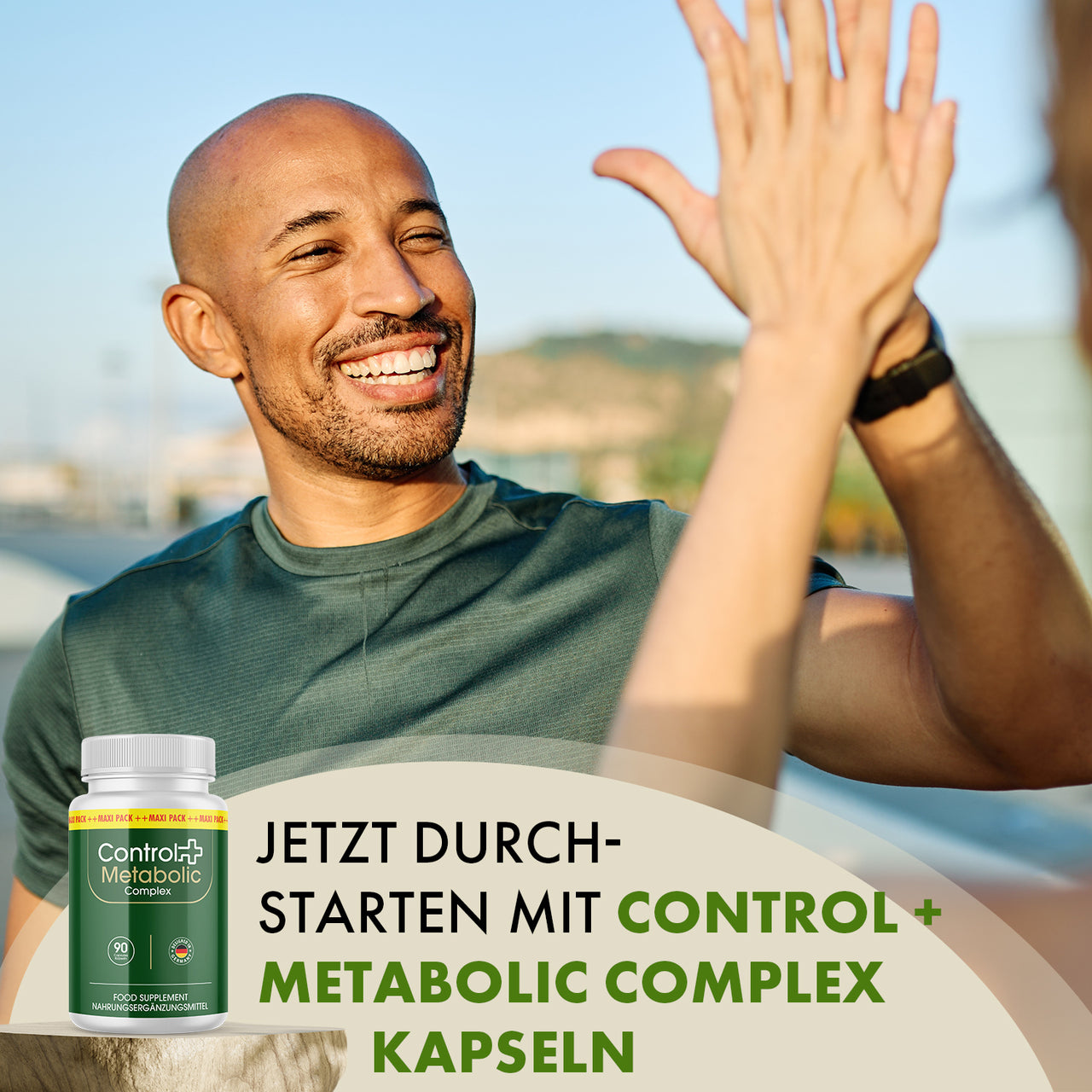 Control + Metabolic Complex Kapseln mit zwei Personen beim High-Five und motivierendem Werbeslogan