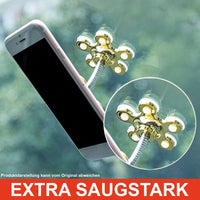 Thumbnail for  Goldfarbener Handyhalter mit Saugnäpfen hält Smartphone an Fensterscheibe, Schriftzug extra saugstark