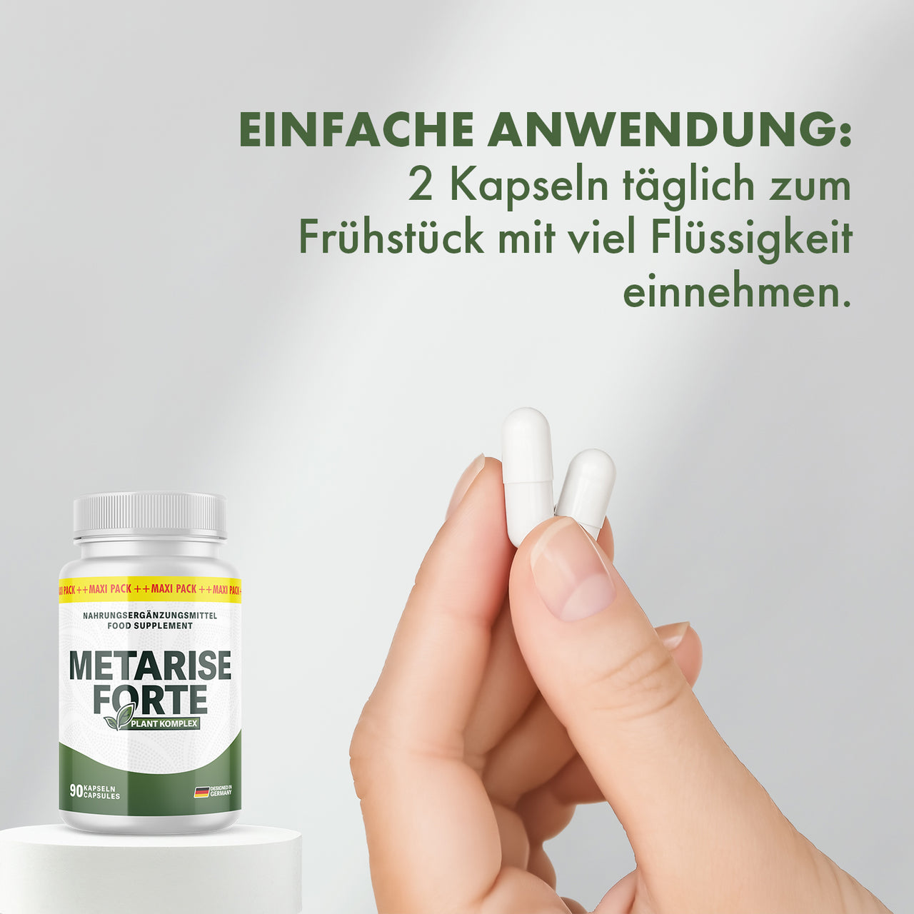 Hand hält zwei Kapseln, Metarise Forte und Hinweis zur Einnahme