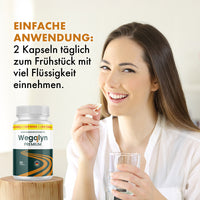 Thumbnail for Person hält zwei Kapseln und ein Glas Wasser, daneben Wegolyn Premium mit dem Einnahmehinweis